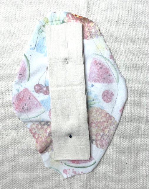 How to sew comfortable sanitary pad Pinning absorbent layers to top piece with pins.