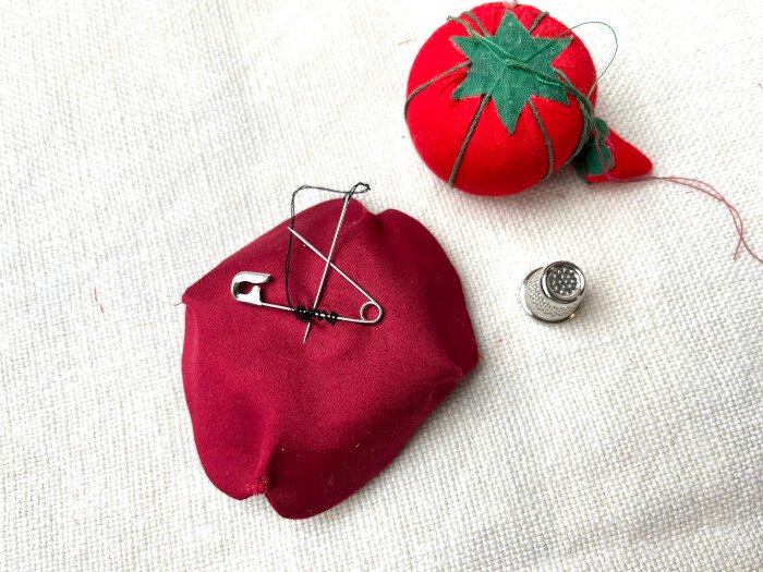 Attaching safety pin to the Remembrance Day poppy