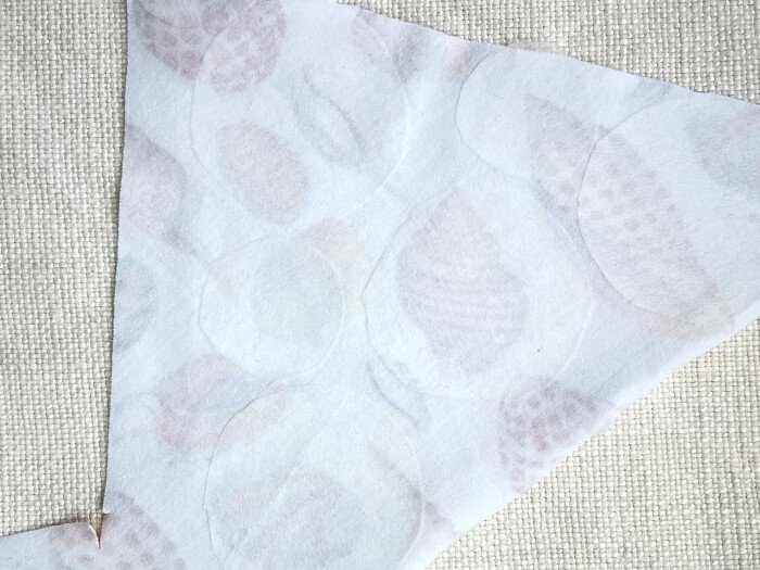 Spots glued on reverse of fabric off cuts