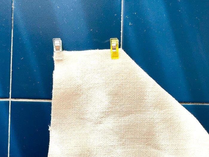 Clip together the boxed corners to shape the cover.