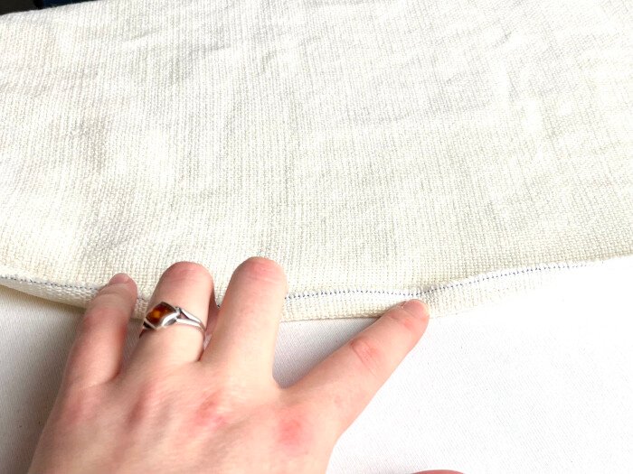 Double fold the hem allowance along the pressed line.