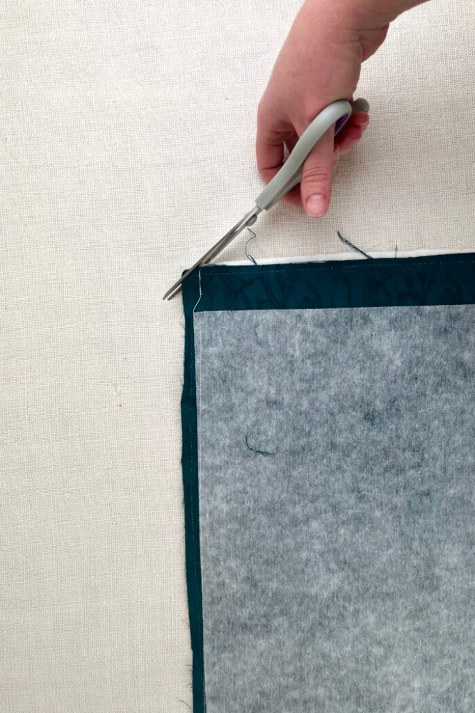 Trimming the corners of the fabric advent calendar.