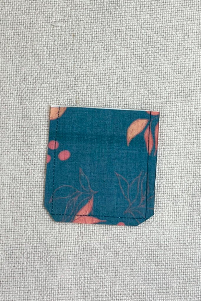 Trimming the corners of the pockets for fabric advent calendar.