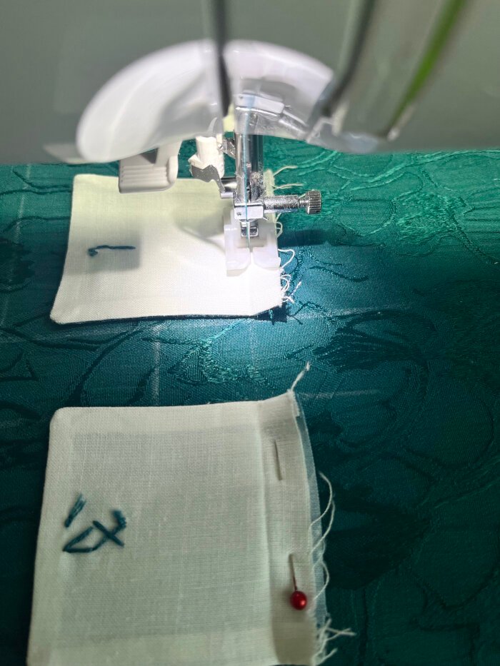 Pockets being stitched onto the advent calendar backing, starting from the top row for even alignment.