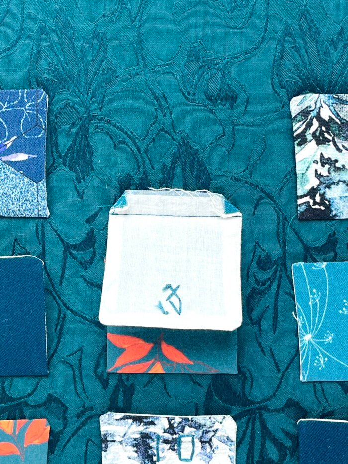 The seam allowance pressed in corners to hide them from peeking out. 