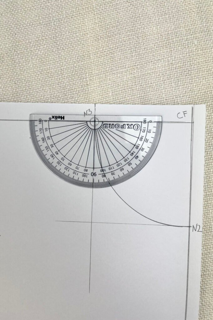 Using protractor to draft front shoulder angle.