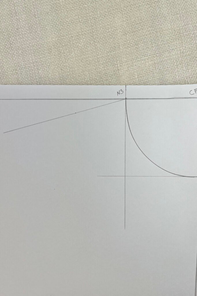 Using protractor to draft front shoulder angle.