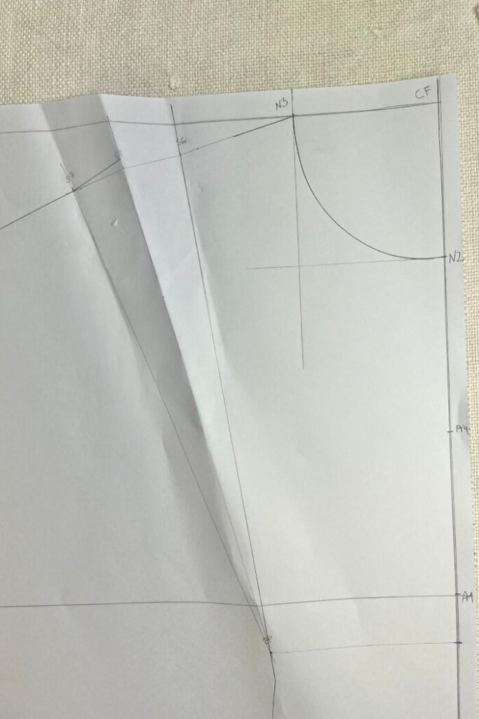 Marking the armhole points on the front bodice block.