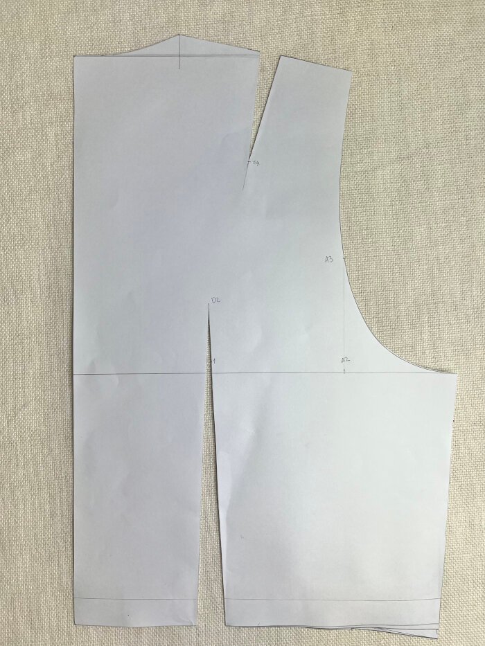 Cutting out the custom bodice block with darts marked and bust point highlighted, ready for trueing and fitting adjustments.