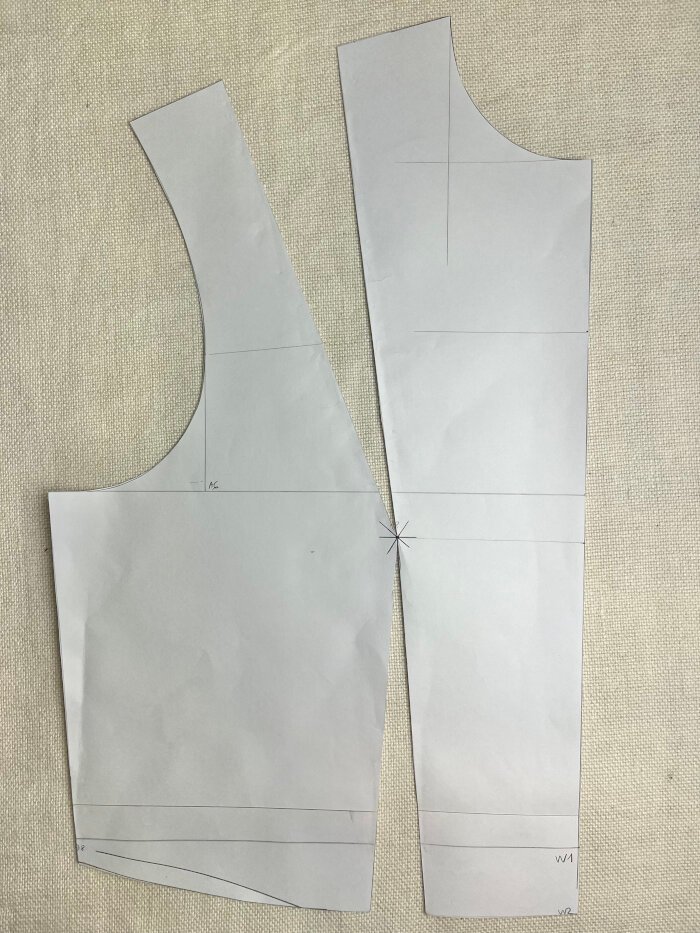 Front bodice block pieces laid out with darts cut open, showing how the shoulder and waist darts meet at the bust apex.