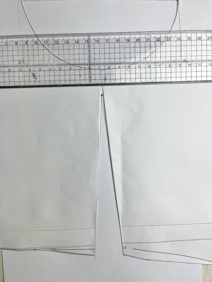 Redrawing the front waist dart to adjust bust ease and create a balanced fit across the bodice block.