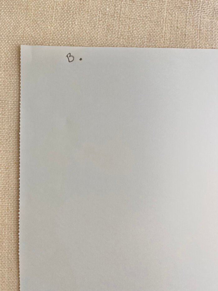 Marking the starting point for drafting the basic sleeve block on pattern paper.