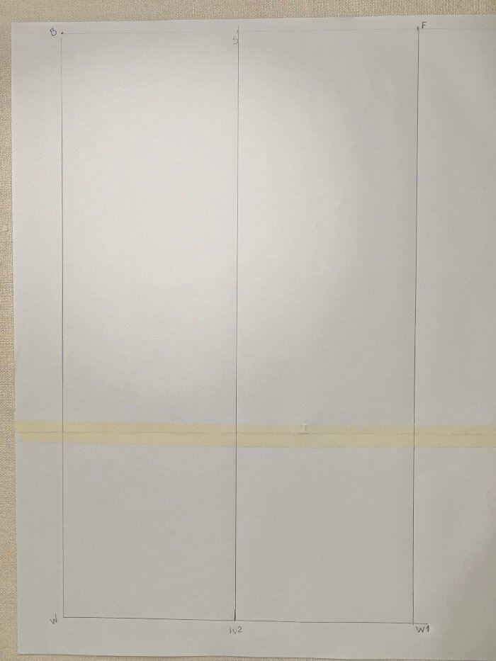 Using a ruler to define the height and width of the sleeve pattern draft.