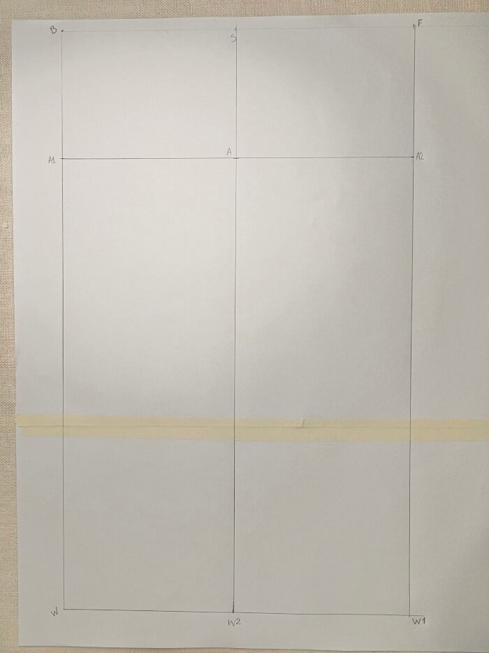 Marking sleeve crown height between shoulder point and lower arm line on the sleeve block.