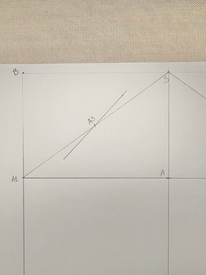 Using a protractor to create sleeve crown angles for accurate sleeve pattern drafting.