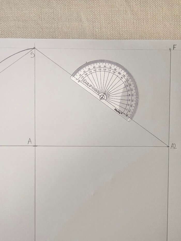 Shaping the front sleeve armhole curve using measured angles and curved rulers.