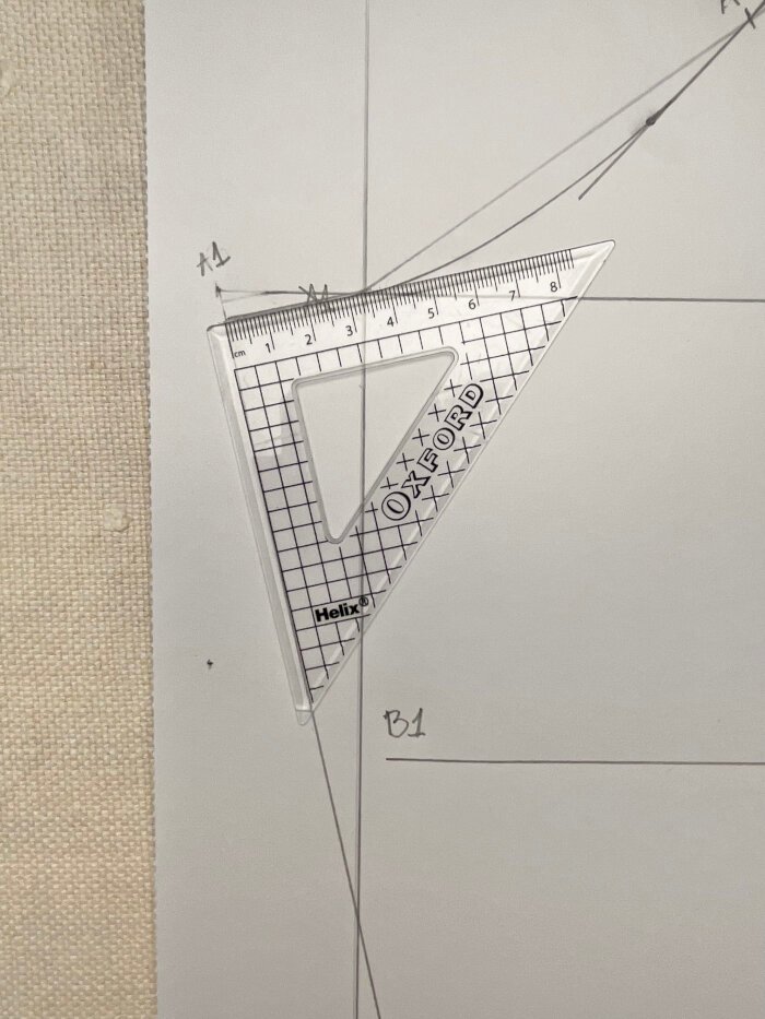 Adjusting side seam lines to create straight angle at the sleeve crown. 