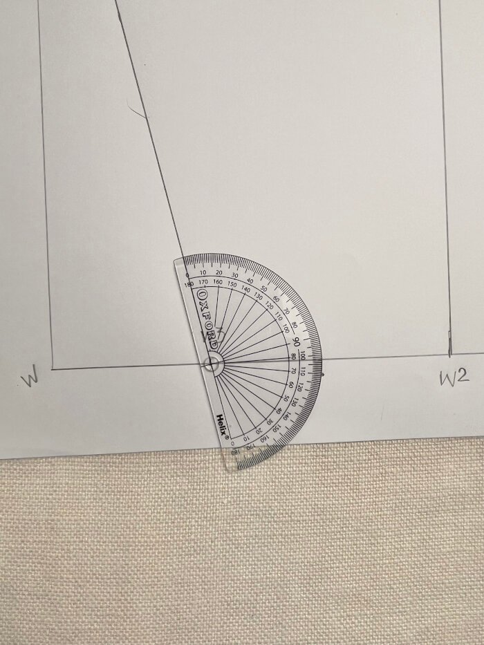 Using a protractor to angle the wrist line for a smooth sleeve block finish.