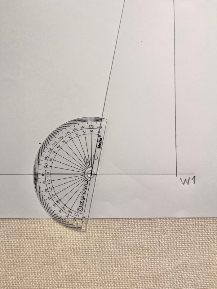 Using a protractor to angle the wrist line for a smooth sleeve block finish.