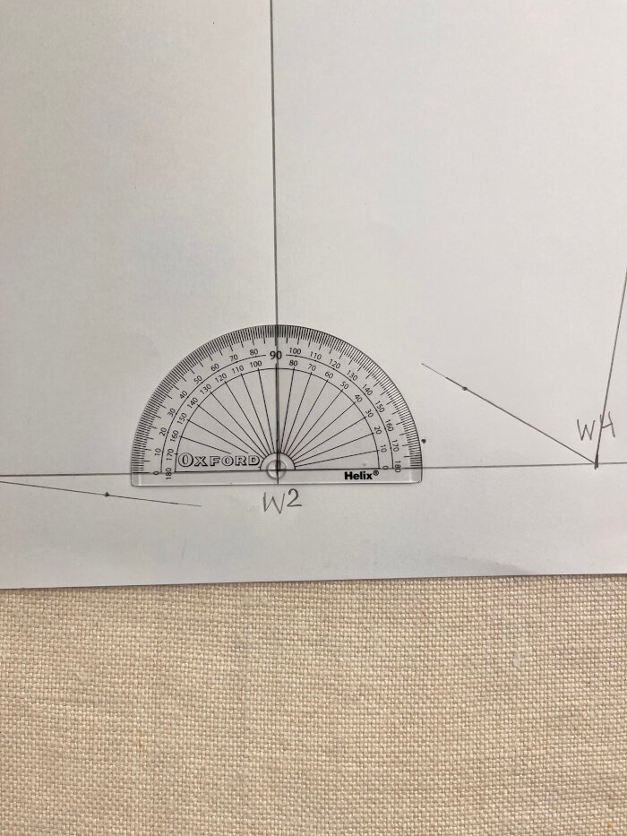 Using a protractor to angle the wrist line for a smooth sleeve block finish.