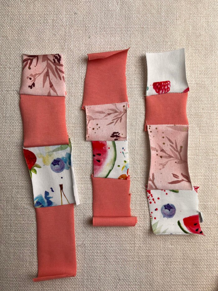 Patchwork fabric scrap sewing in fours for a heart shaped coaster