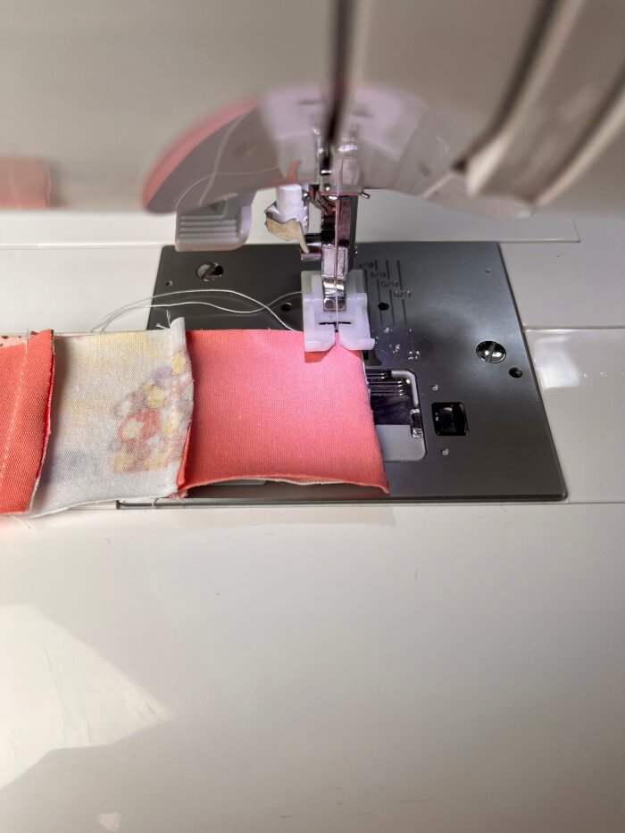 Patchwork fabric scrap chains prepared for a heart shaped coaster