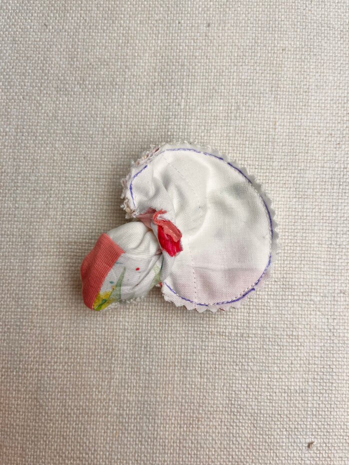 Turning and pressing the finished heart shaped coaster