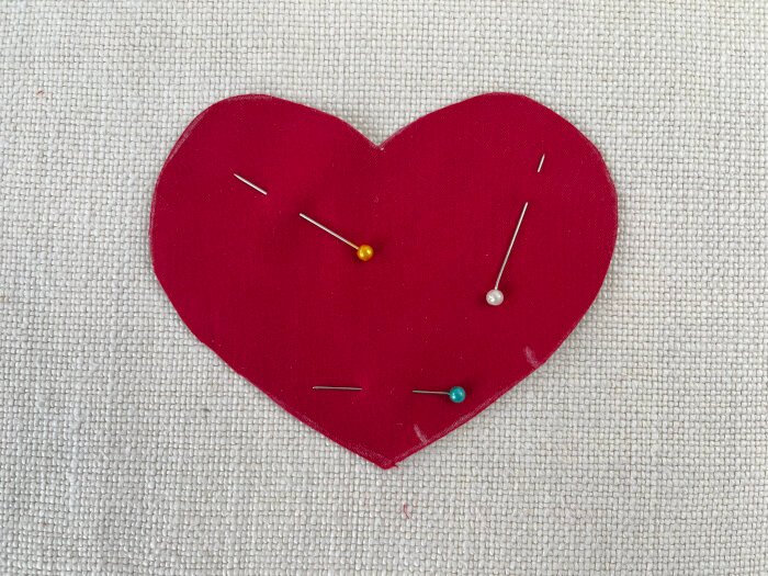 Cutting heart shaped fabric pieces with added seam allowance for a fabric brooch