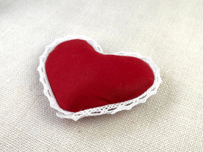 Fabric brooch with lint removed.