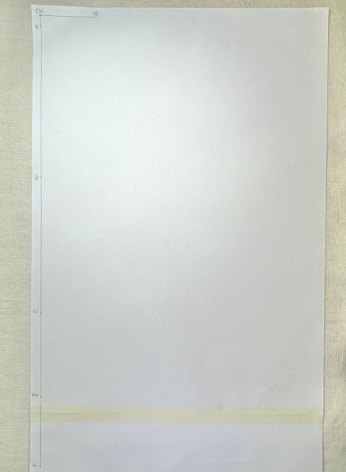 Marking neckline width on a basic T-shirt bodice block using neck circumference measurement.