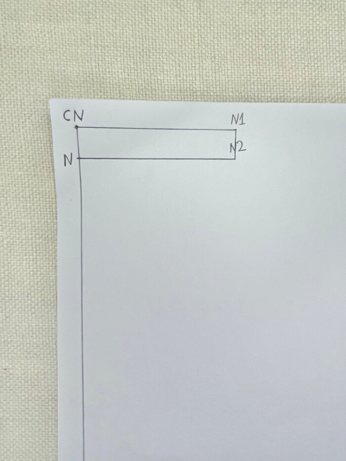 Marking back neckline width and depth on a basic T-shirt bodice block.