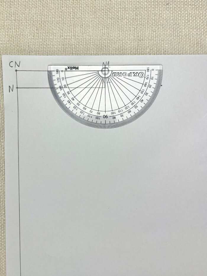 Drafting the shoulder line on a T-shirt pattern using a protractor