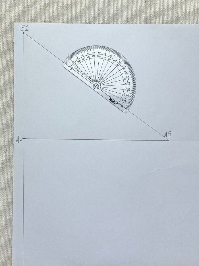 Using protractor to mark angle for t-shirt sleeve cap drafting