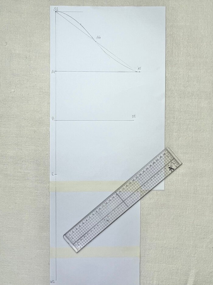 Elbow measurement marked on sleeve block for stretch fabric sleeve