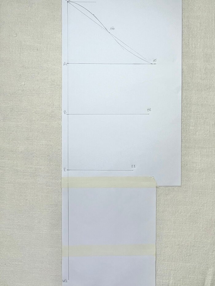 Elbow measurement marked on sleeve block for stretch fabric sleeve