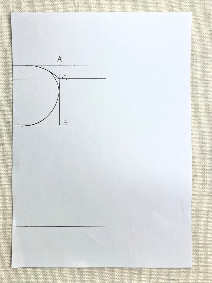 Marking chest coverage depth on baby drool bib pattern for heavy drooling