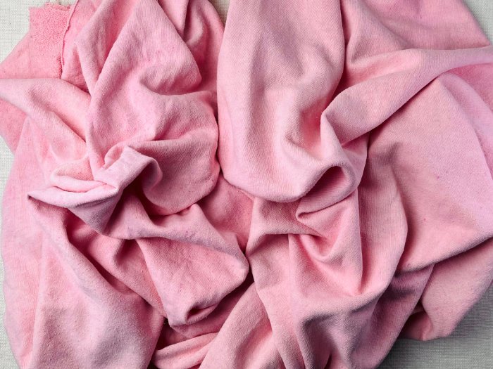 Comparison of dyed hemp fabric showing softened, relaxed texture on the left and crisp, stiff hemp fabric on the right after washing and air drying