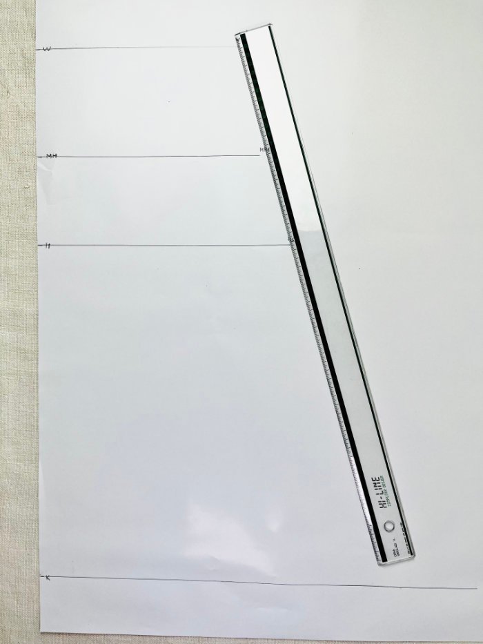 Planning the side seam of an A-line skirt pattern using a ruler
