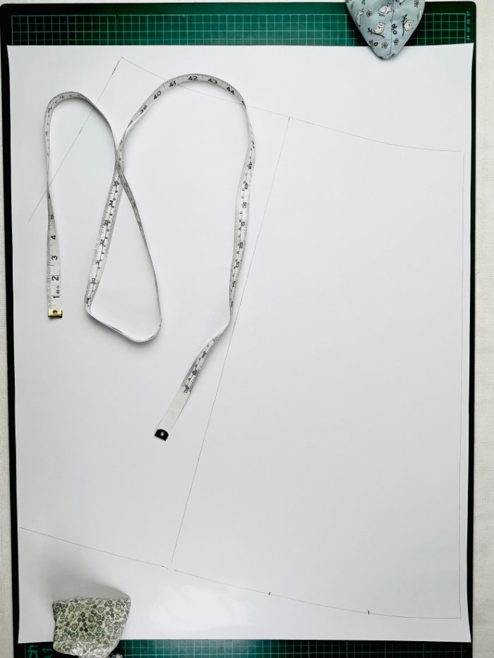 How to Draft a Wrap Skirt Sewing Pattern from an A-Line Block (Beginner Pattern Drafting Tutorial) Hem of A-line skirt block divided into thirds for wrap skirt overlap