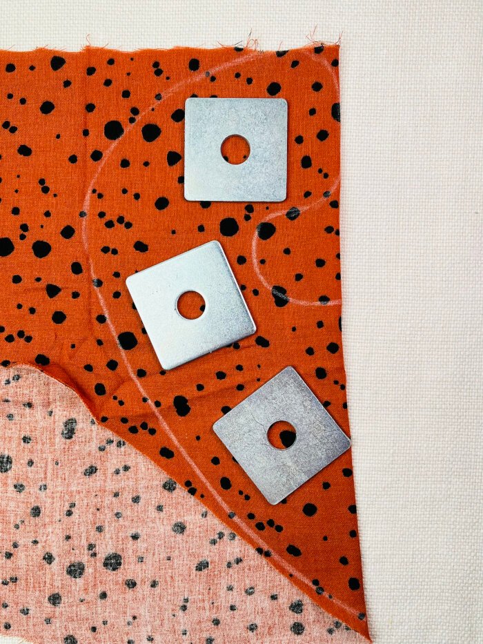 How to Sew a Baby Drool Bib (Easy Step-by-Step Sewing Tutorial) Tracing a baby drool bib pattern onto fabric using soap for marking