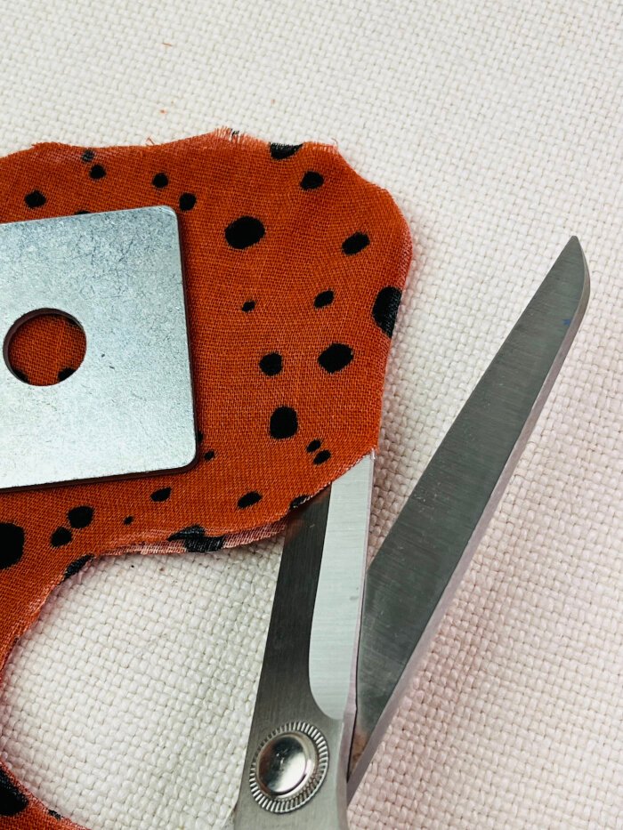 How to Sew a Baby Drool Bib (Easy Step-by-Step Sewing Tutorial) Cutting baby drool bib fabric pieces at the back fold line