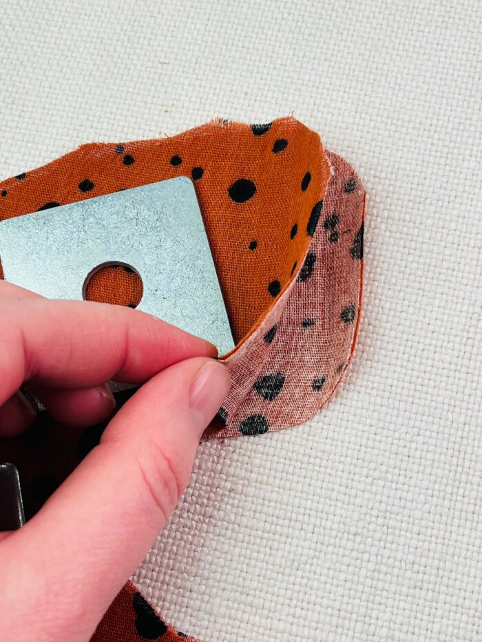 How to Sew a Baby Drool Bib (Easy Step-by-Step Sewing Tutorial) Cutting baby drool bib fabric pieces at the back fold line