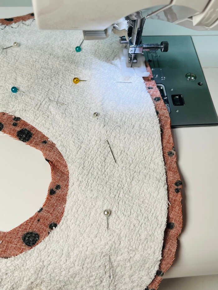 How to Sew a Baby Drool Bib (Easy Step-by-Step Sewing Tutorial) Zigzag stitching absorbent layer onto baby drool bib outer fabric