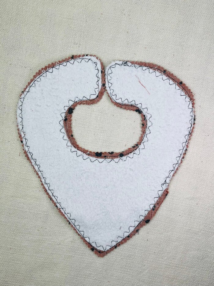 How to Sew a Baby Drool Bib (Easy Step-by-Step Sewing Tutorial) Trimming and clipping seam allowances on a baby drool bib to reduce bulk