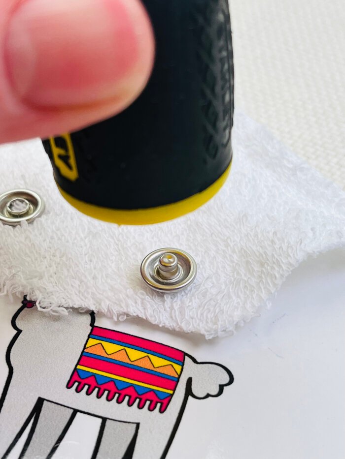 Setting metal snap stud using a household tool on a flat surface without snap pliers