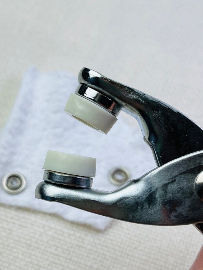 Uneven surface of hand held pliers when attaching metal snap buttons.