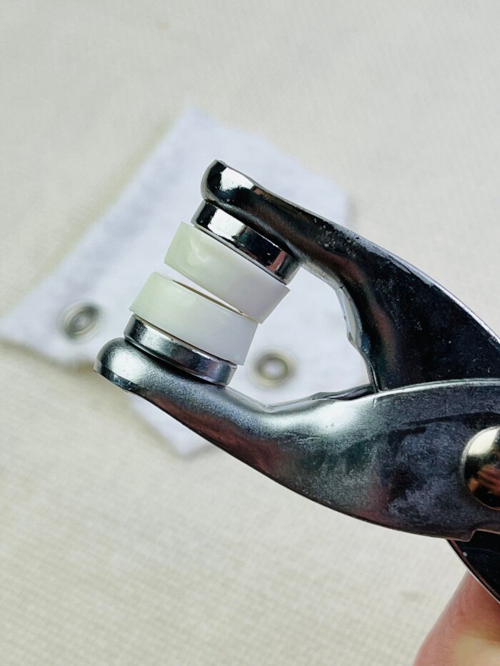 Uneven surface of hand held pliers when attaching metal snap buttons.