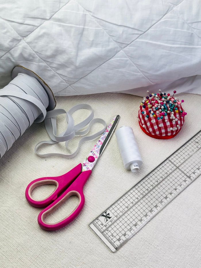 How to Fix Loose Elastic on a Waterproof Mattress Protector (Easy DIY Repair) Materials needed to fix elastic on waterproof mattress protector including elastic, thread and scissors