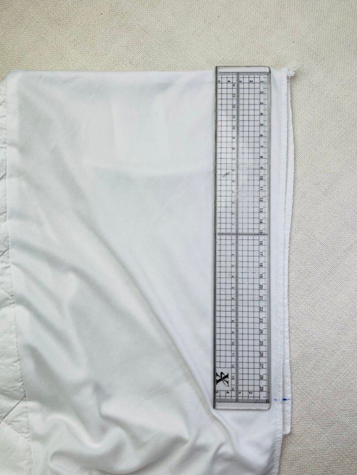 How to Fix Loose Elastic on a Waterproof Mattress Protector (Easy DIY Repair) Folding mattress protector corner to evenly mark elastic sewing area