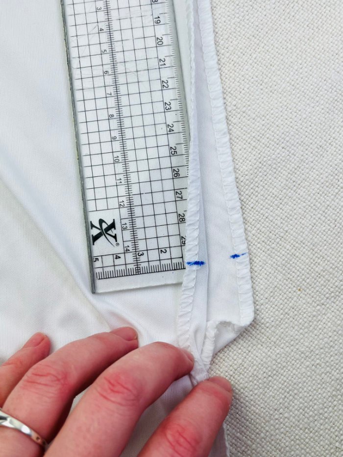 How to Fix Loose Elastic on a Waterproof Mattress Protector (Easy DIY Repair) Evenly marked elastic placement on waterproof mattress protector